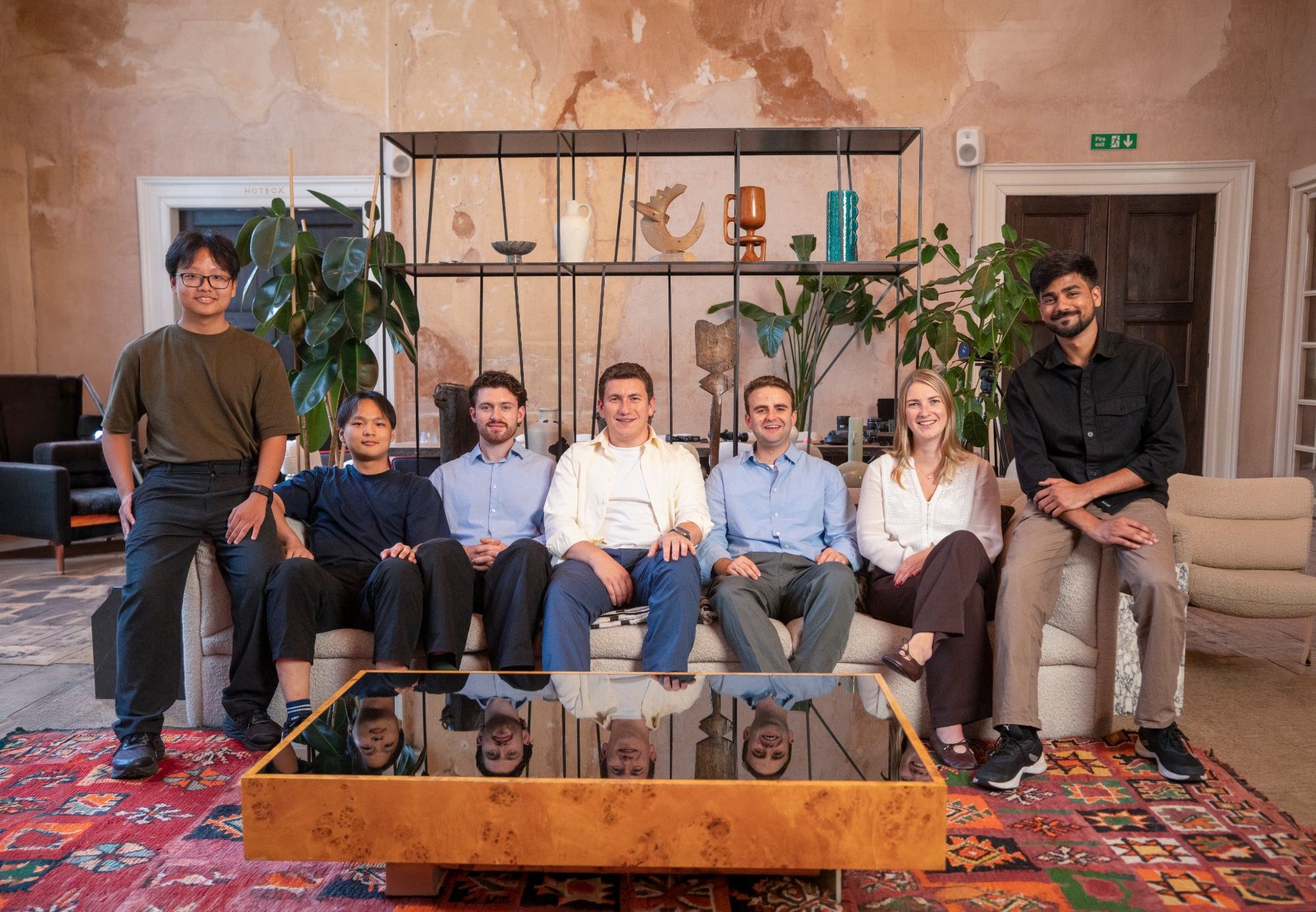 The Tallia team seated together in the London office